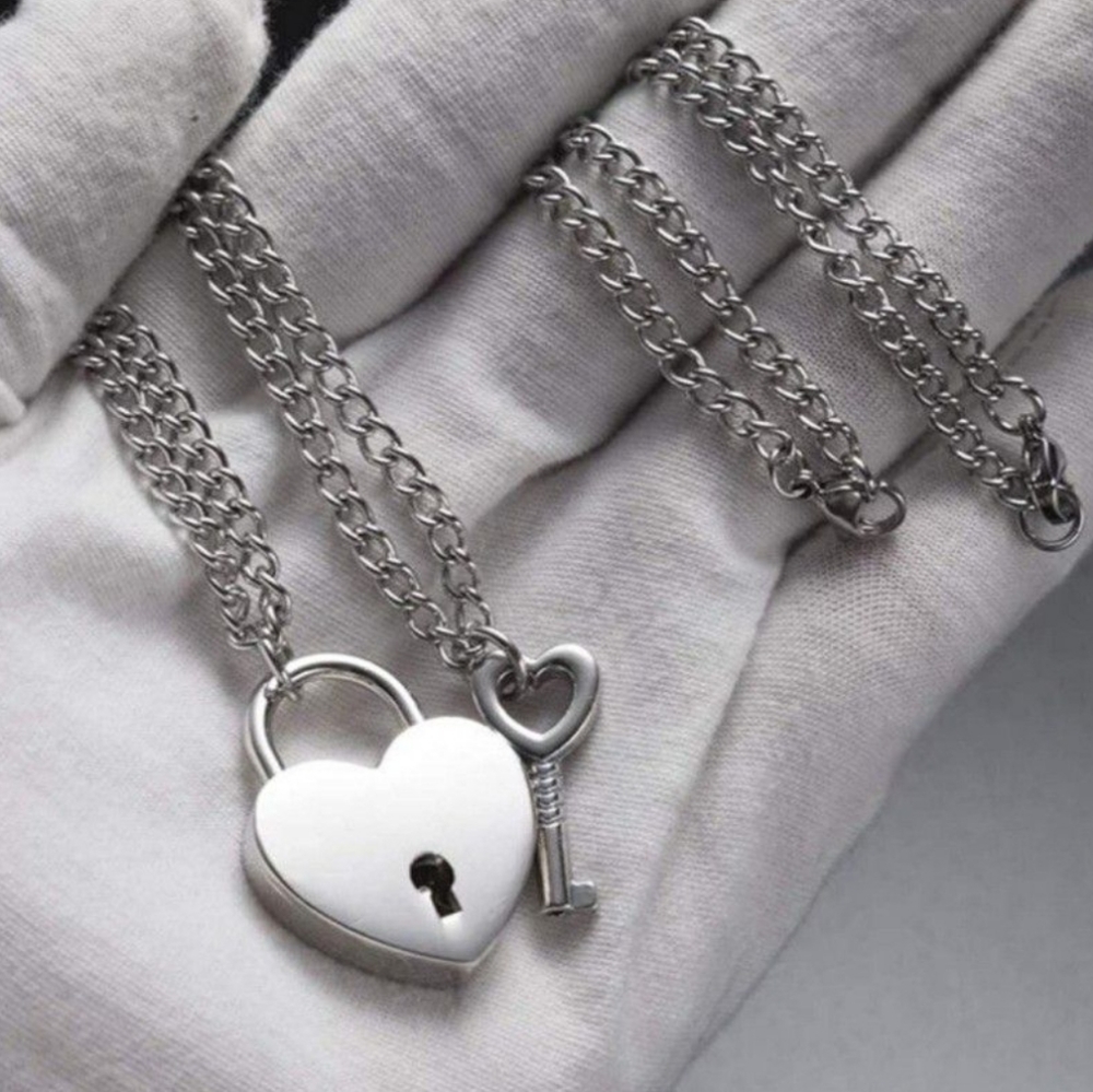 (2 necklaces) 1 heart padlock necklace AND 1 heart key necklace.  Lock opens